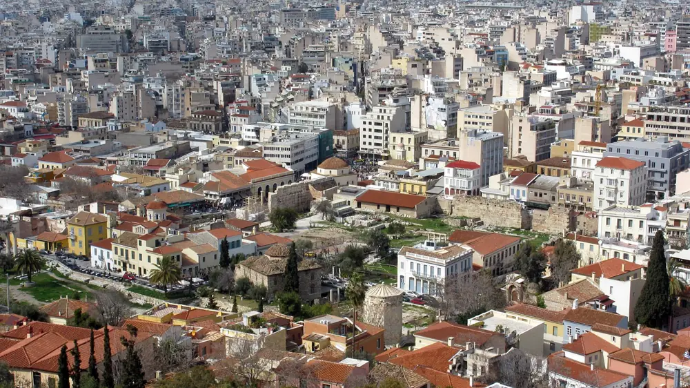 The tiled roofs of Plaka and Monastiraki with the Roman Agora and the Tower of the Winds, seen from the Acropolis, Athens, Greece