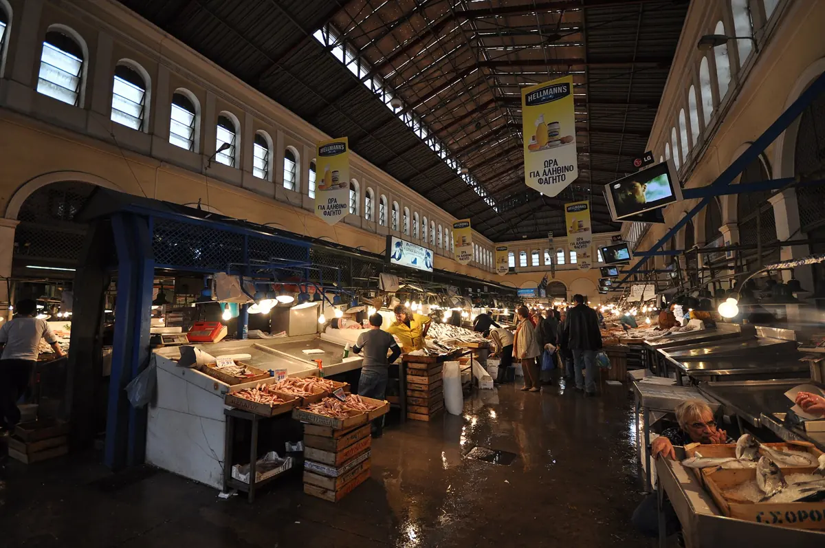 Stalls and shoppers in the central market of Athens, where the city buys its food, Greece