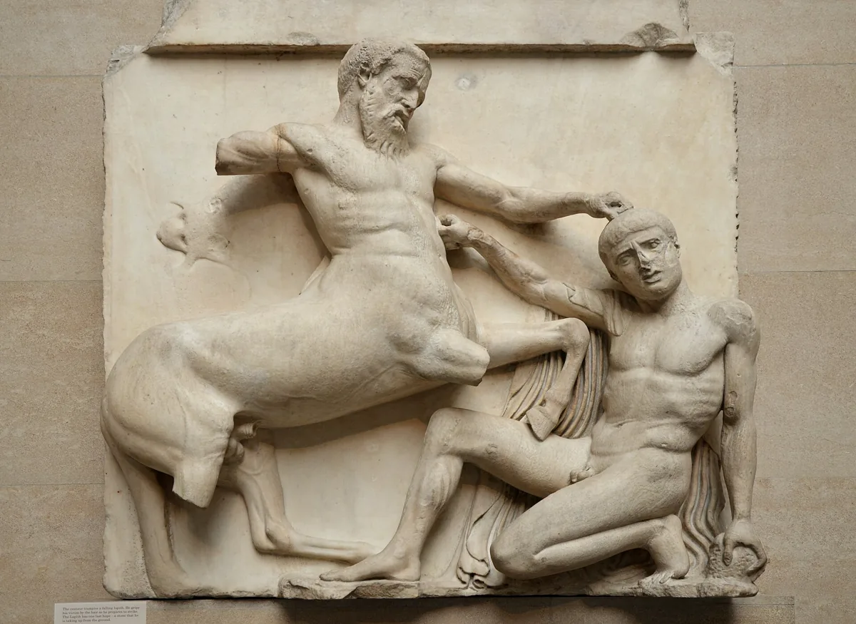 A Parthenon metope in the British Museum showing a centaur trampling a falling Lapith, one of the fifteen removed from the Parthenon in Athens, Greece